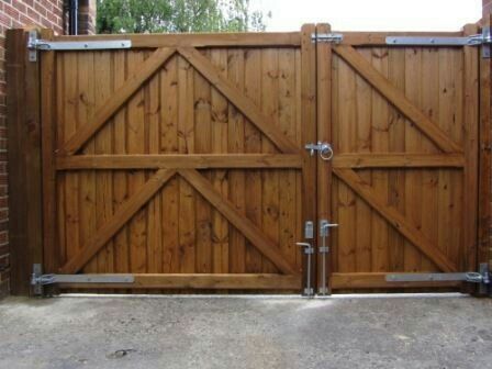 wide wood fence with diagonal bracing