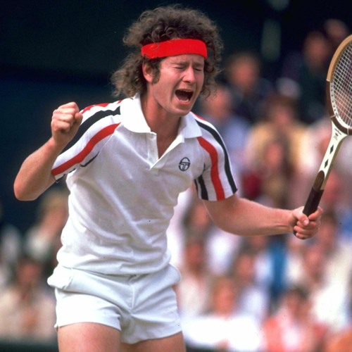 Pic of a young John McEnroe, with headband and frizzy hair